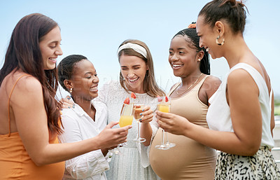Buy stock photo Shot of a group of female friends toasting to their pregnant friend at a baby shower