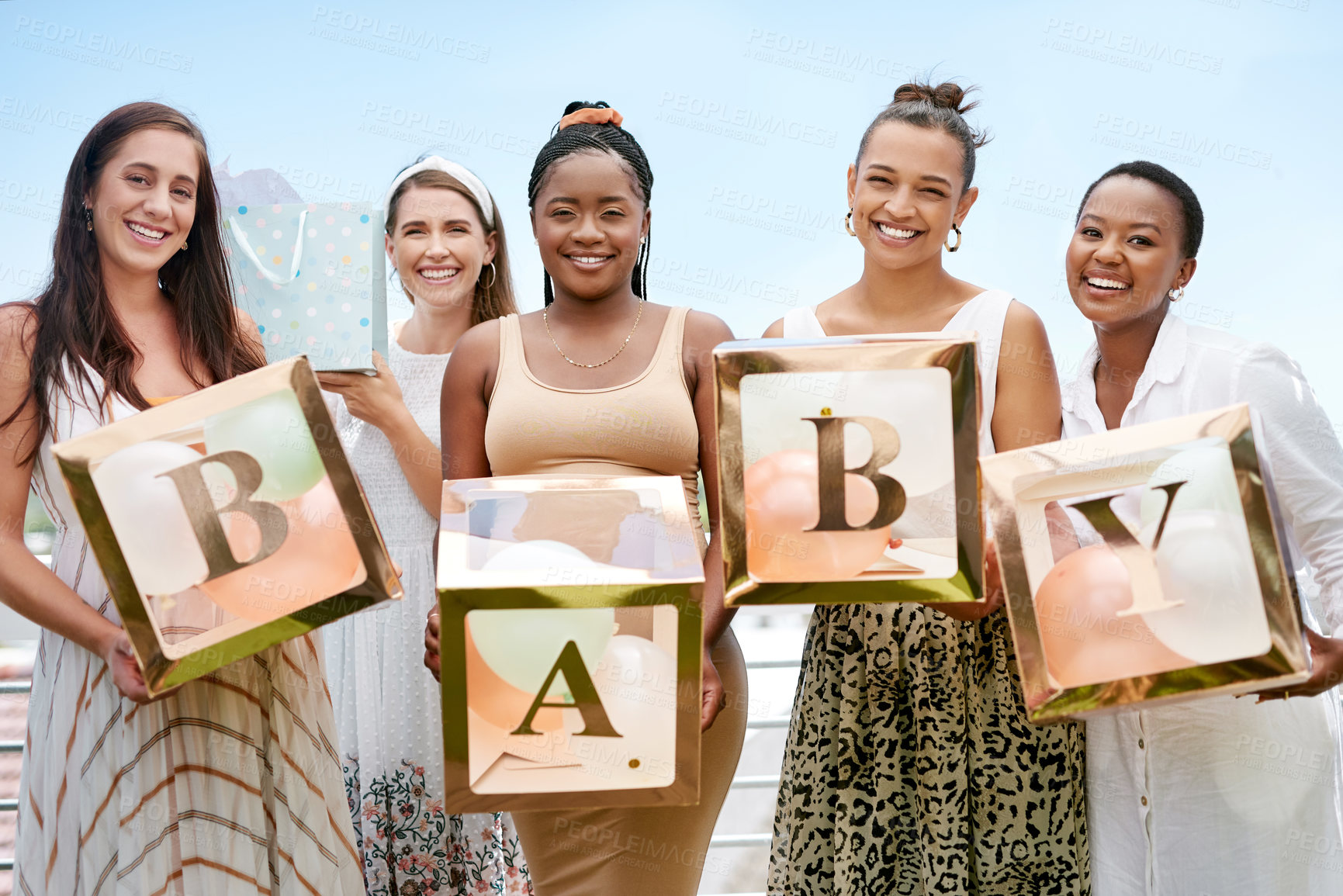 Buy stock photo Shot of a group of women holding a sign at a friends baby shower