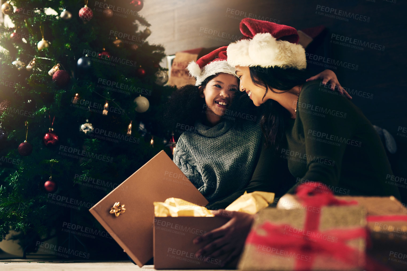 Buy stock photo Mother, girl and Christmas gift, holiday celebration and happy surprise, tree decoration and smile in home. Woman, child and happiness with box, celebrate or surprise together, present in family home