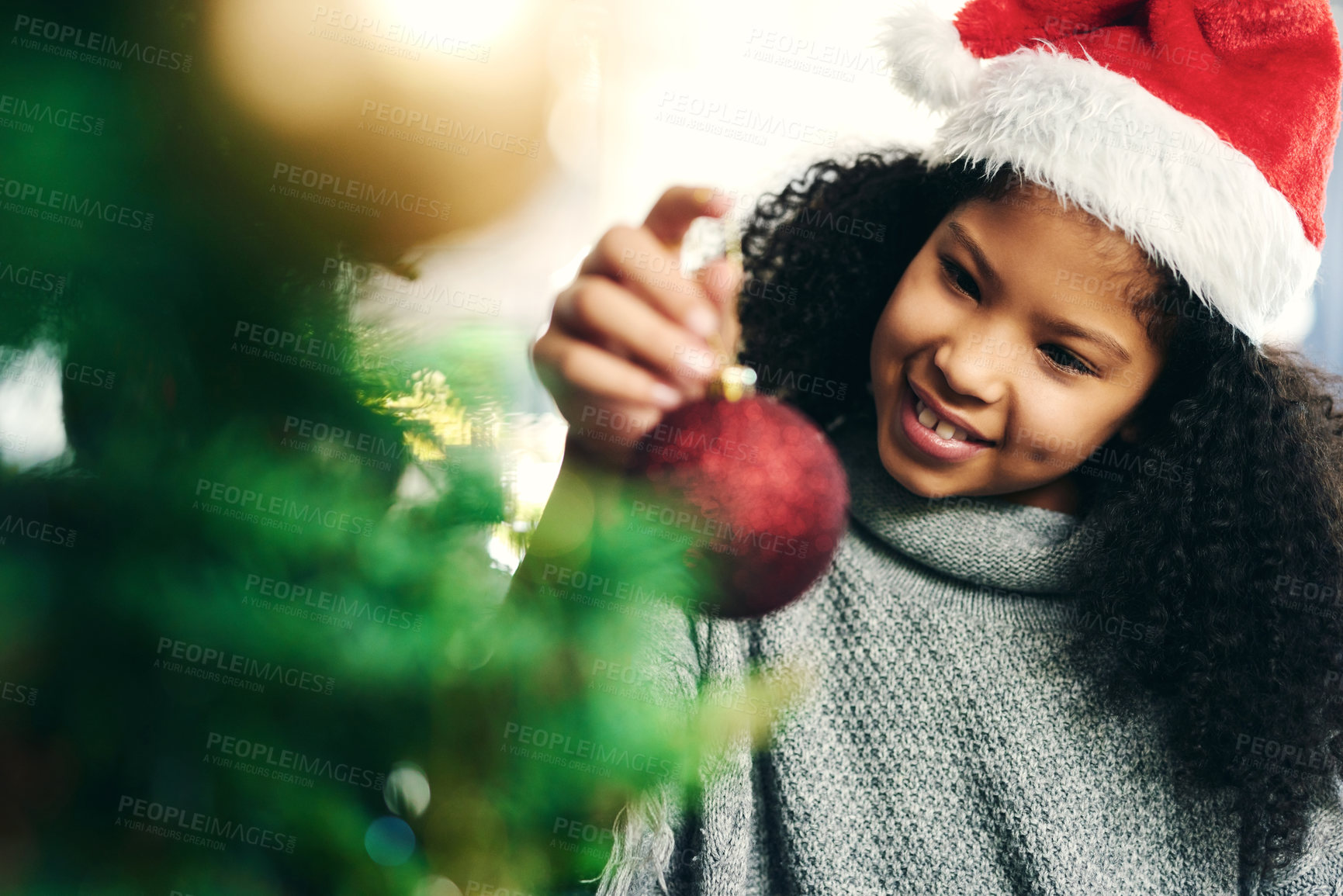 Buy stock photo Christmas, tree and girl with ornament, happy and celebration for holiday, smile and content. Xmas, black kid and female child with decorations for festive season, happiness and cheerful for vacation