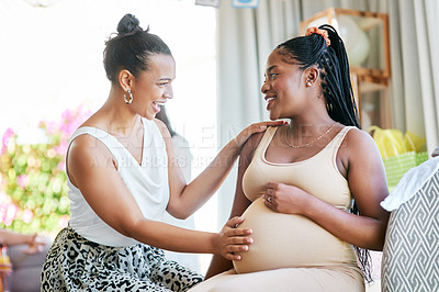 Buy stock photo Pregnant, friends and woman touching a stomach, baby shower and excited with happiness, home and support. Female people, girls and lady feeling belly, pregnancy and event with celebration and party