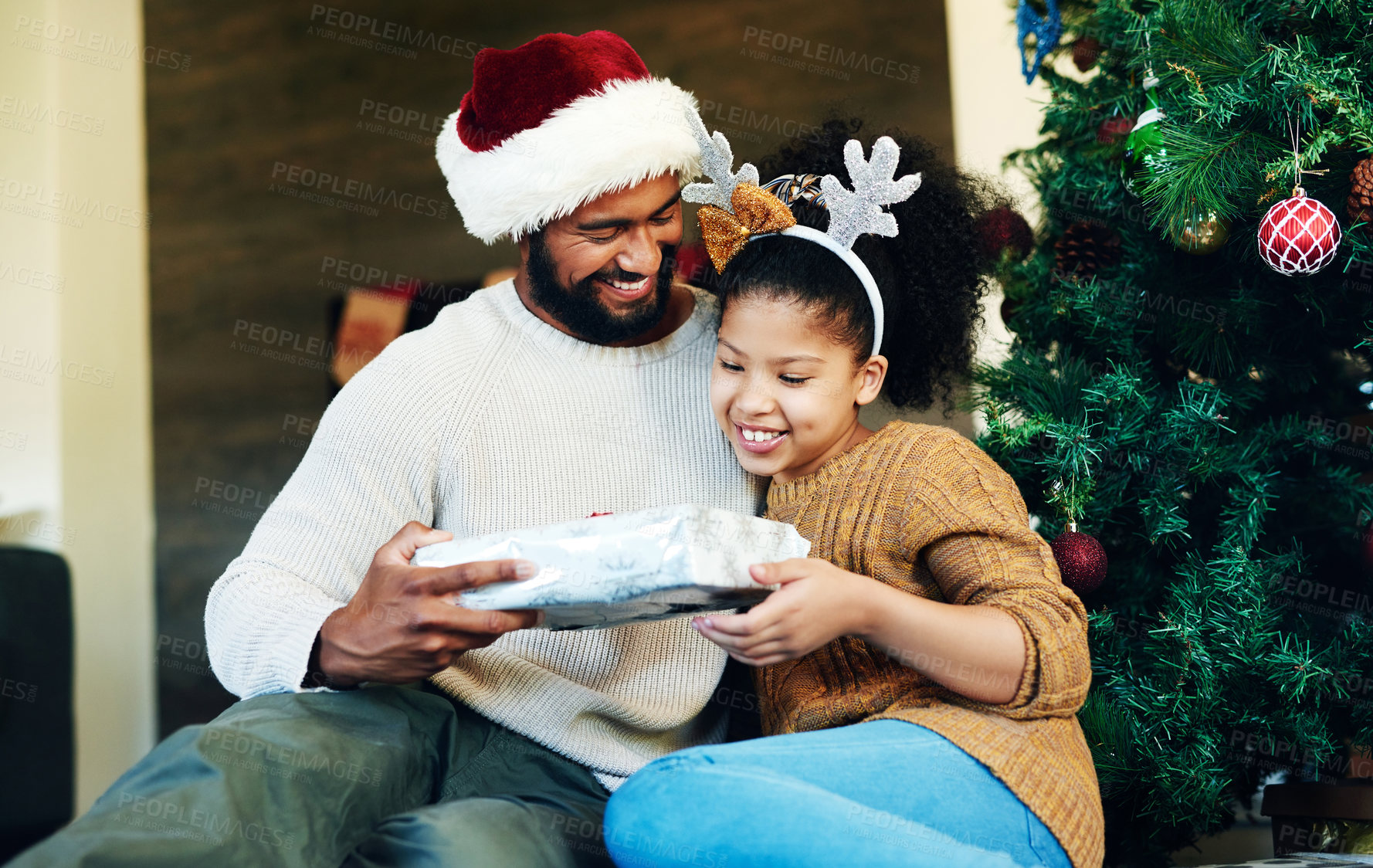 Buy stock photo Father, child and giving christmas gift for holiday celebration with family, love and care while together and happy at home. Man and girl daughter on floor with a surprise present to celebrate xmas