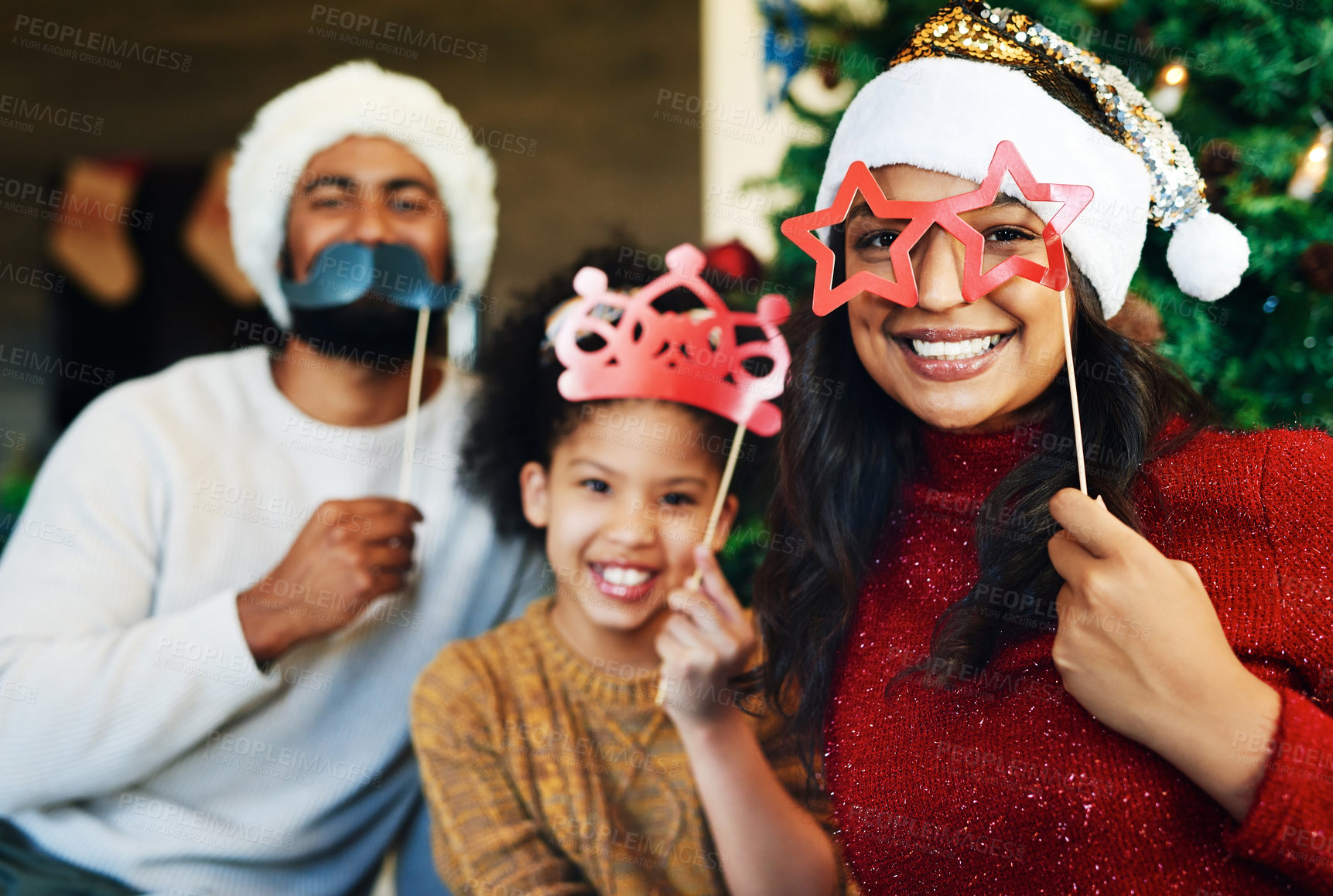 Buy stock photo Christmas, props and portrait of girl with family celebration with happy of mom, father and kid love together at home. Xmas vacation party, holiday bonding and mother with child smile in living room 