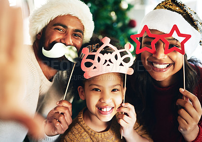 Buy stock photo Christmas, selfie and portrait of family with decoration masks, glasses and crown for comic picture together. Love, festival celebration and child with mom and dad enjoy holiday, vacation and party