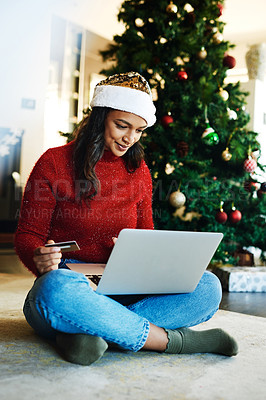 Buy stock photo Christmas, laptop and woman use credit card for payment, happiness or ecommerce for festive season in lounge. Xmas, young female or device for online banking, peace or relax with transaction on floor