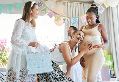 Buy stock photo Shot of a pregnant mother to be receiving gifts from her friends at her baby shower