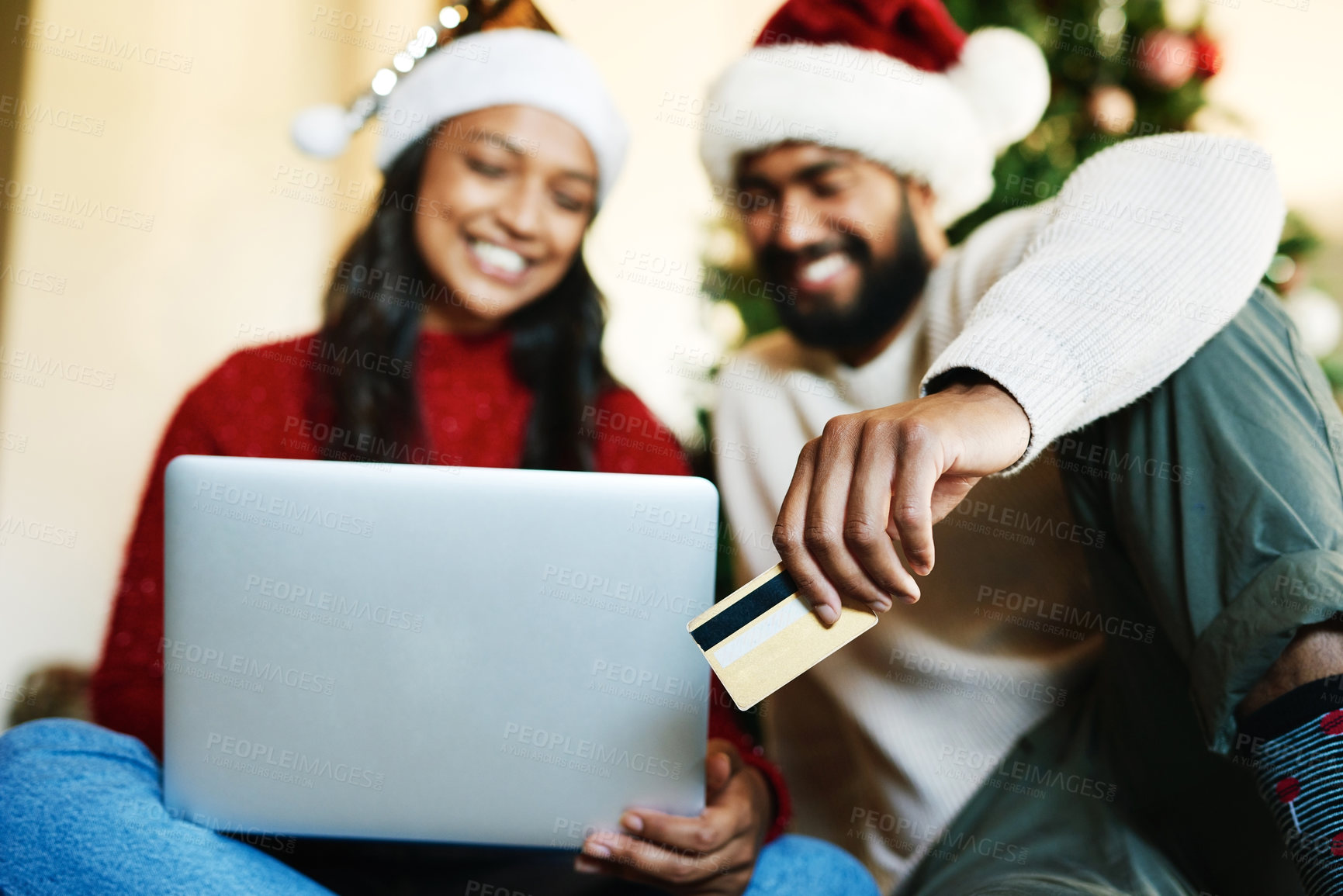 Buy stock photo Laptop, credit card and couple online shopping on Christmas day in home living room. Xmas holiday, fintech and happy man and woman on computer, internet shop or virtual store buying gifts or presents