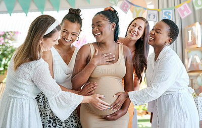 Buy stock photo Shot of a group of friends celebrating at a baby shower