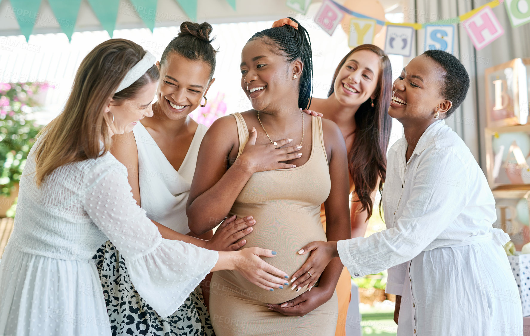 Buy stock photo Shot of a group of friends celebrating at a baby shower