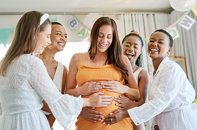 Buy stock photo Shot of a group of friends celebrating at a baby shower