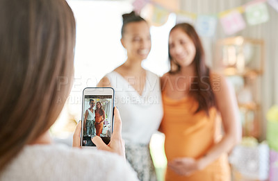 Buy stock photo Shot of a group of women taking photos at their friends baby shower