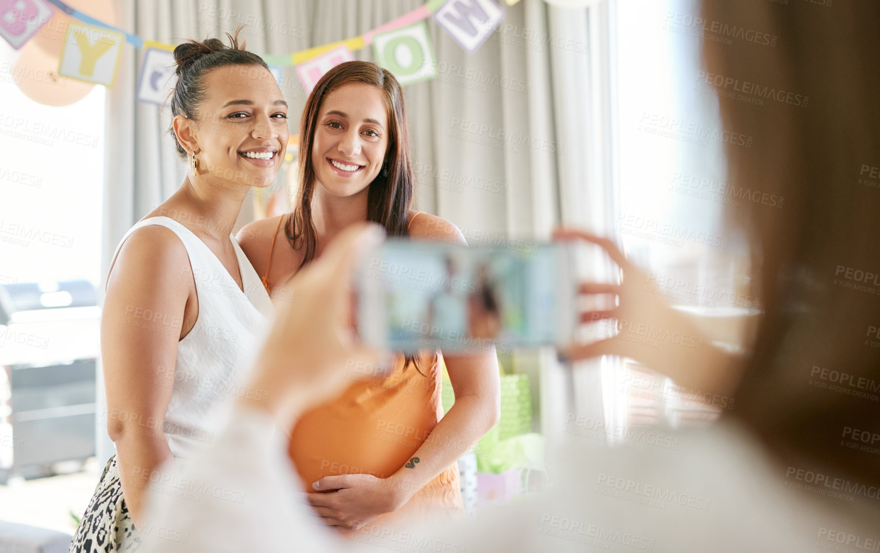 Buy stock photo Shot of a group of women taking photos at their friends baby shower