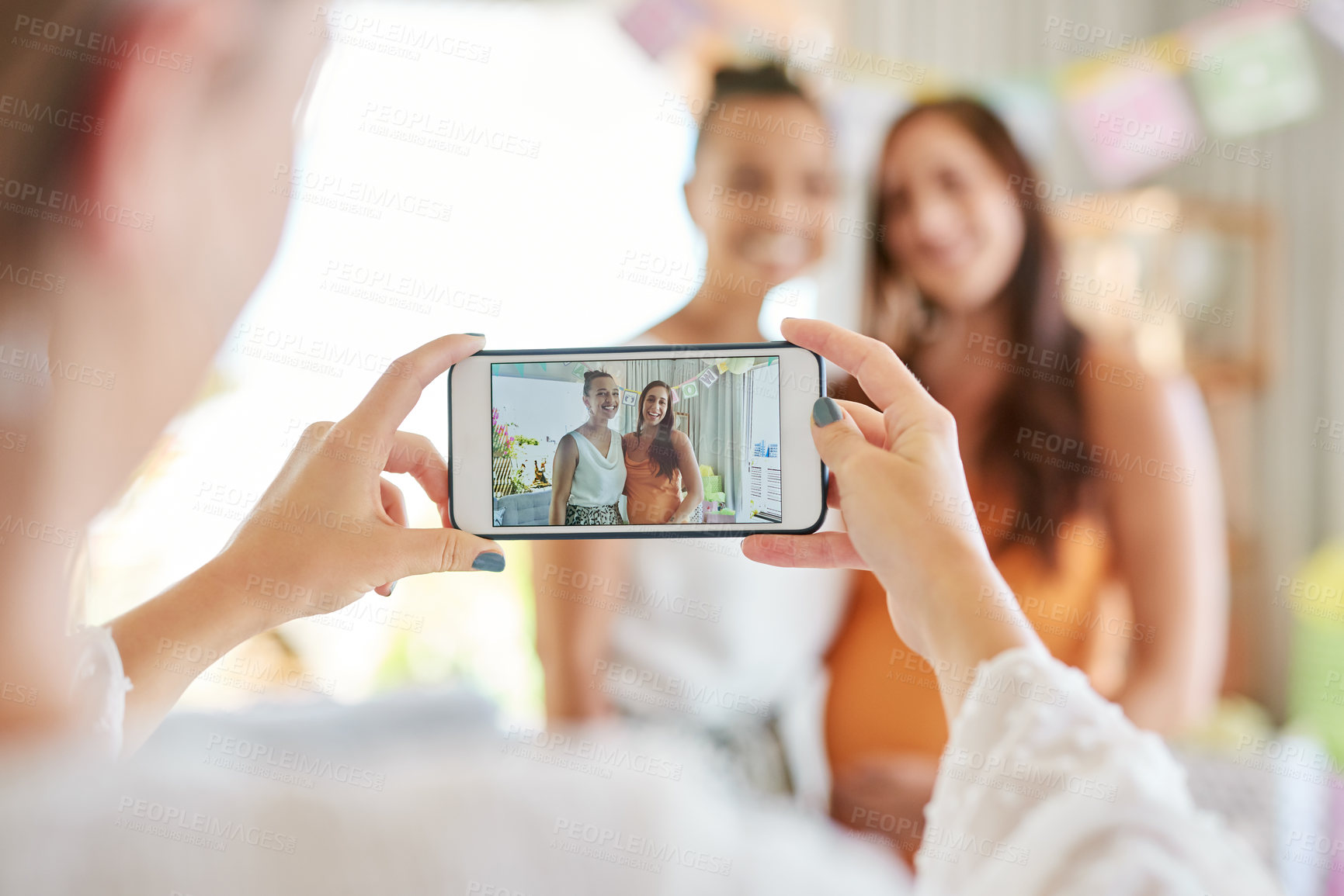 Buy stock photo Shot of a group of women taking photos at their friends baby shower