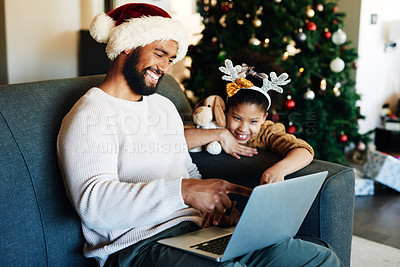 Buy stock photo Christmas, black dad and daughter with laptop on sofa on internet, reading social media and smile. Holiday, father and girl with pc, happy and bonding on couch in family home, living room and web app