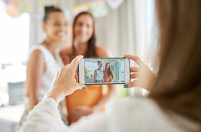 Buy stock photo Shot of a group of women taking photos at their friends baby shower