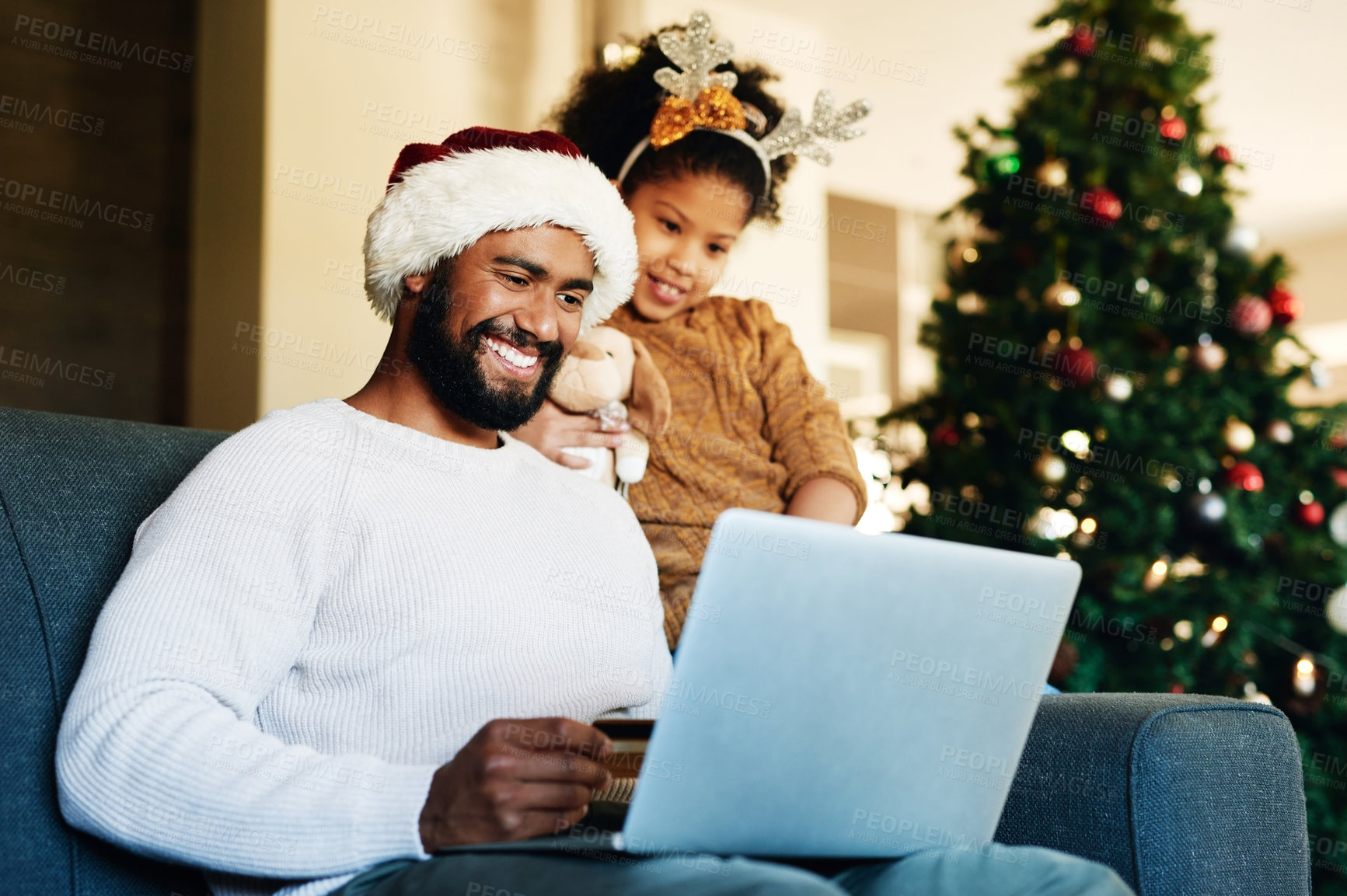 Buy stock photo Father, girl and laptop with christmas ecommerce, credit card or online shopping with smile in home. Dad, daughter and shopping with computer for gift, present or giving in living room at family home