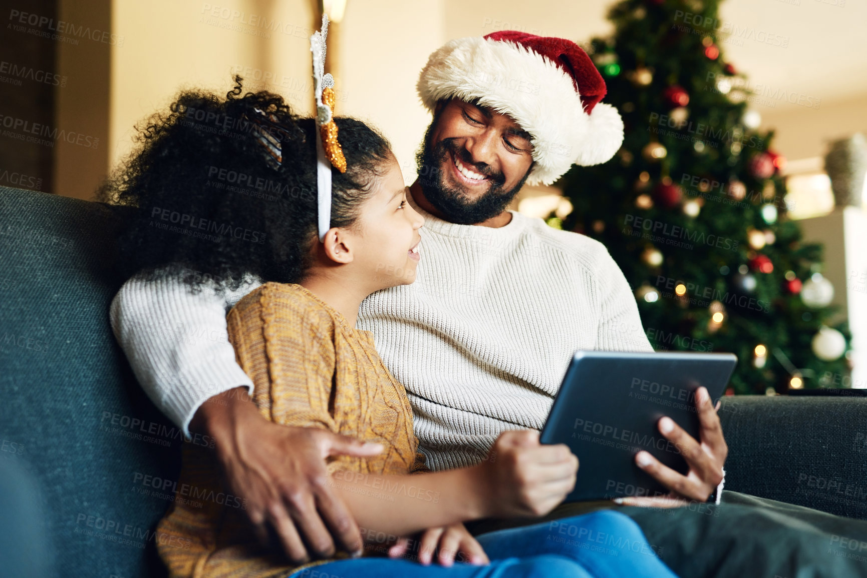 Buy stock photo Christmas, family and digital tablet for live streaming movie, fun game or social media on house living room sofa. Happy smile mother, father and girl with technology in home in festive xmas holiday
