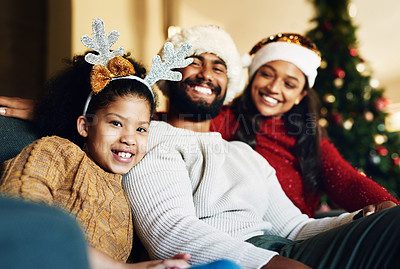 Buy stock photo Happy family, christmas hat or bonding in house or home living room on celebration holiday, festive event or vacation. Portrait, smile or xmas girl, child or kid and mother, father or parents on sofa