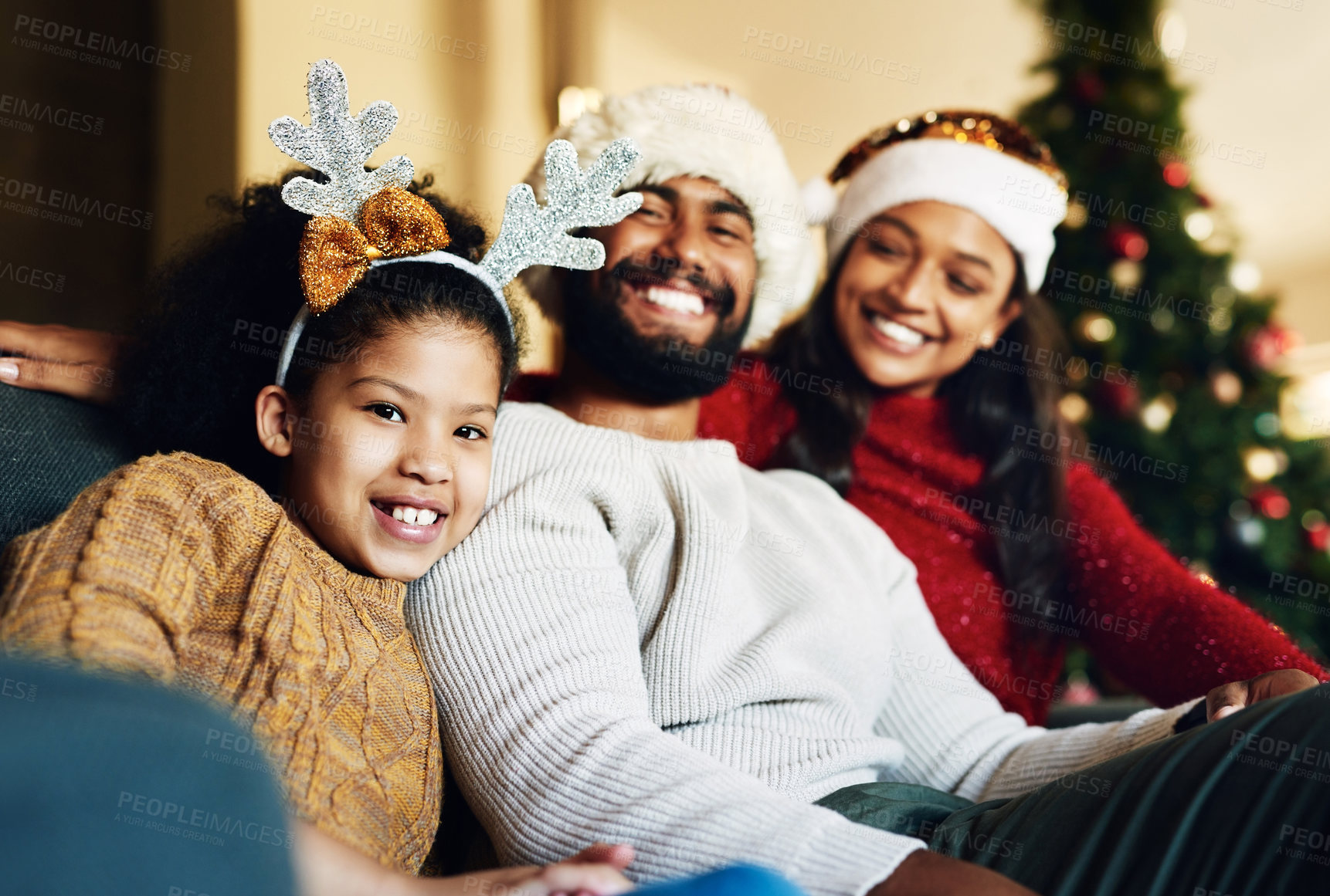 Buy stock photo Happy family, christmas hat or bonding in house or home living room on celebration holiday, festive event or vacation. Portrait, smile or xmas girl, child or kid and mother, father or parents on sofa
