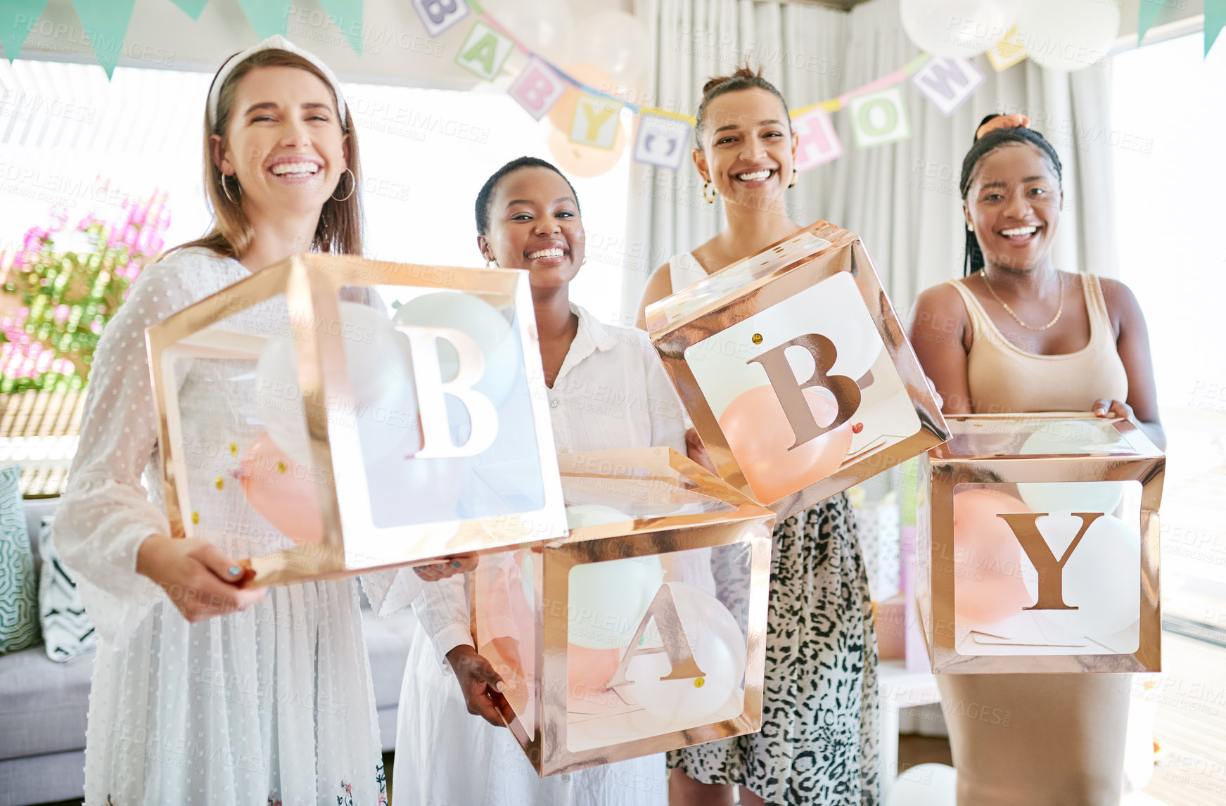 Buy stock photo Shot of a group of women holding a sign at a friends baby shower