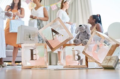 Buy stock photo Shot of a group of women holding a sign at a friends baby shower