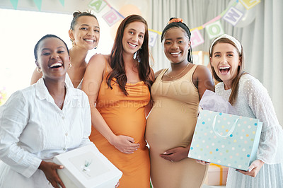 Buy stock photo Shot of a group of friends taking photos at a friends baby shower