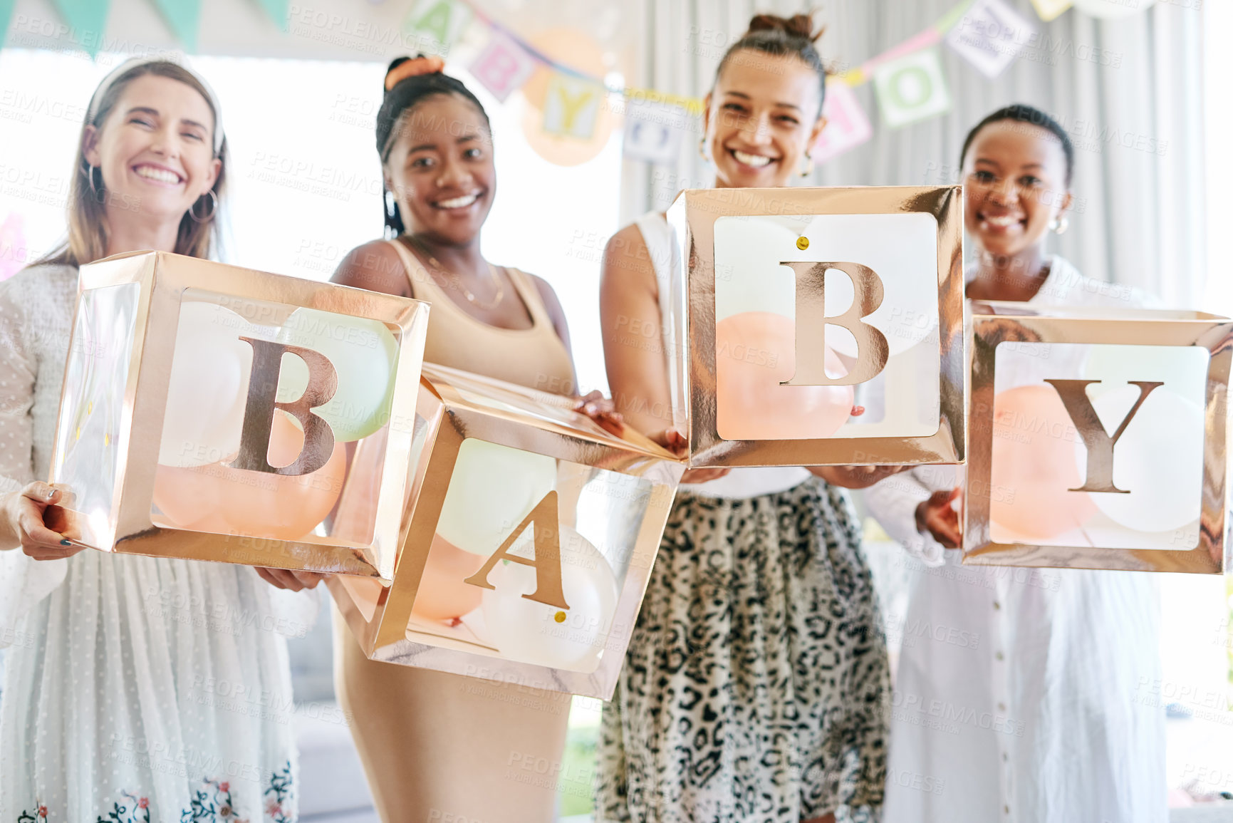 Buy stock photo Shot of a group of women holding a sign at a friends baby shower