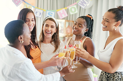 Buy stock photo Shot of a group of female friends toasting to their pregnant friend at a baby shower