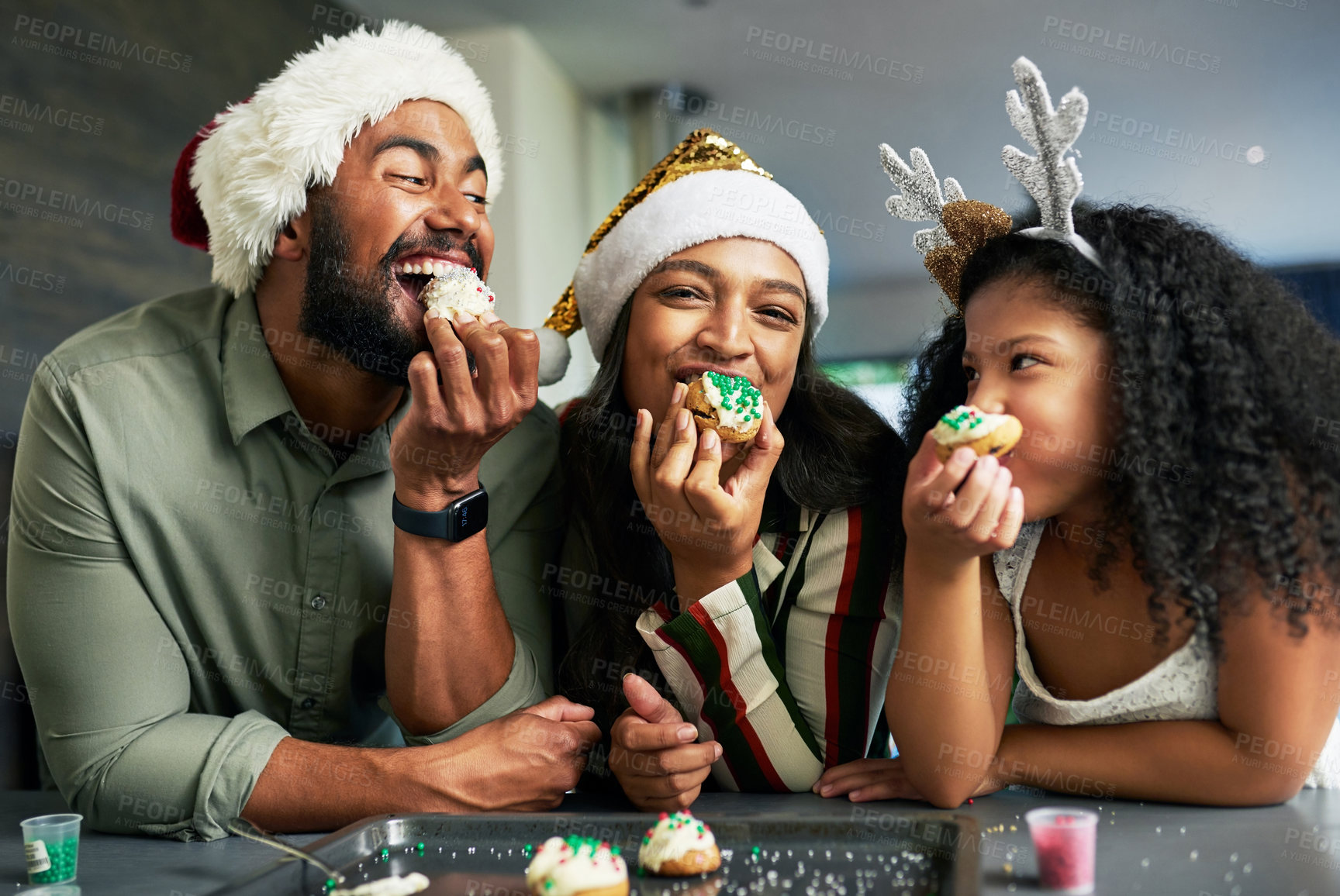 Buy stock photo Family, christmas and eating cookies together after baking and cooking for bonding and learning. Bake, cook and sweet biscuit dessert with a mother, father and daughter enjoying food snack