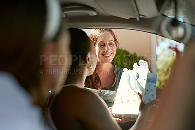 Buy stock photo Shot of a group of young women surprising their friend with a drive by baby shower