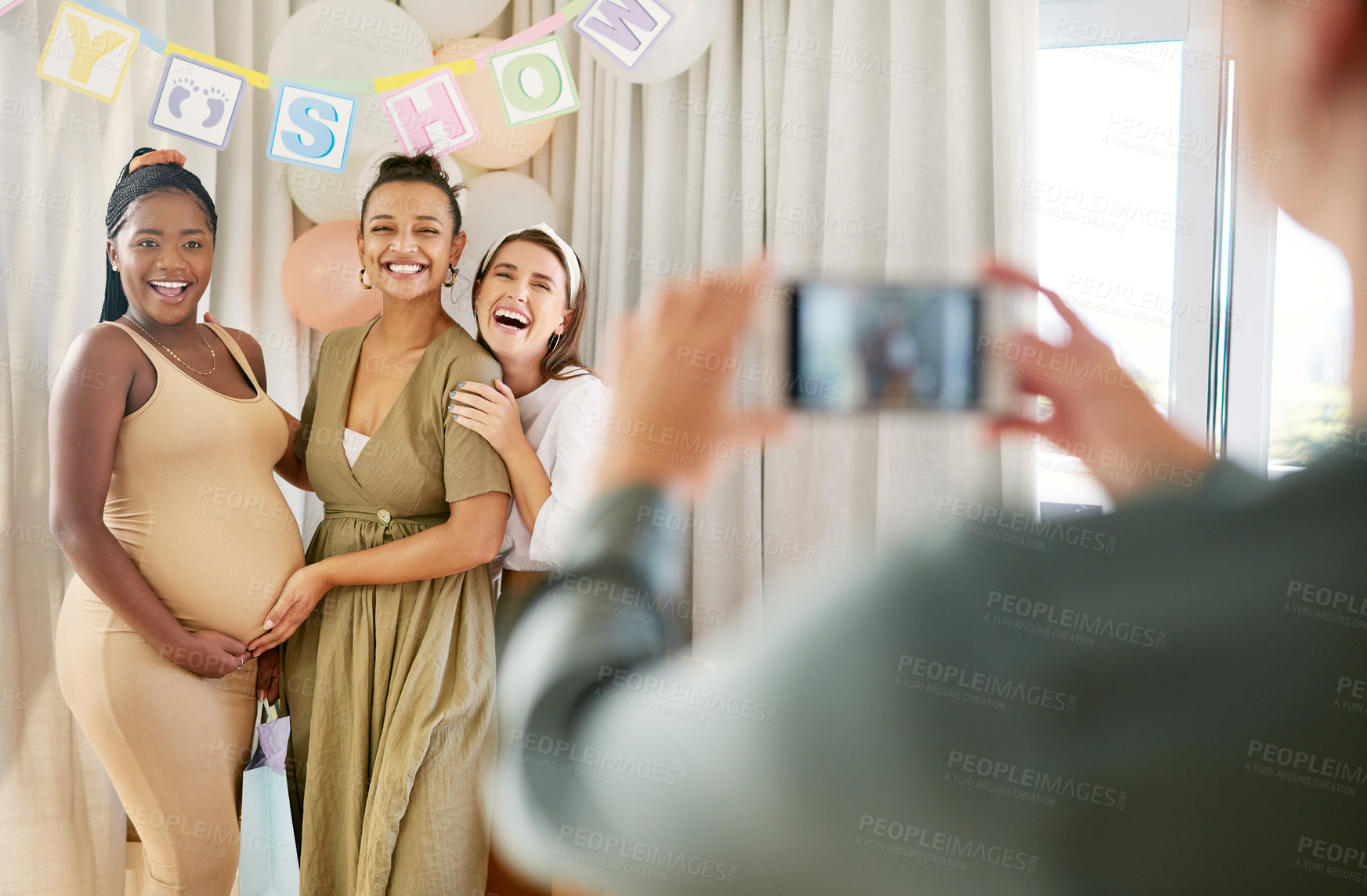 Buy stock photo Shot of a group of women taking photos at their friends baby shower