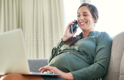 Buy stock photo Shot of a young mother to be working from home using her smartphone