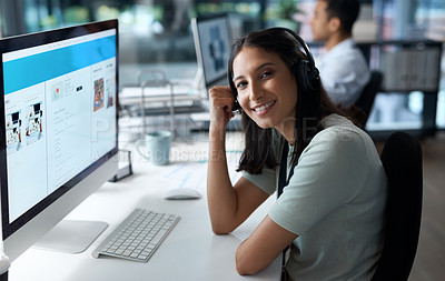 Buy stock photo Portrait of a young woman using a headset and computer in a modern office