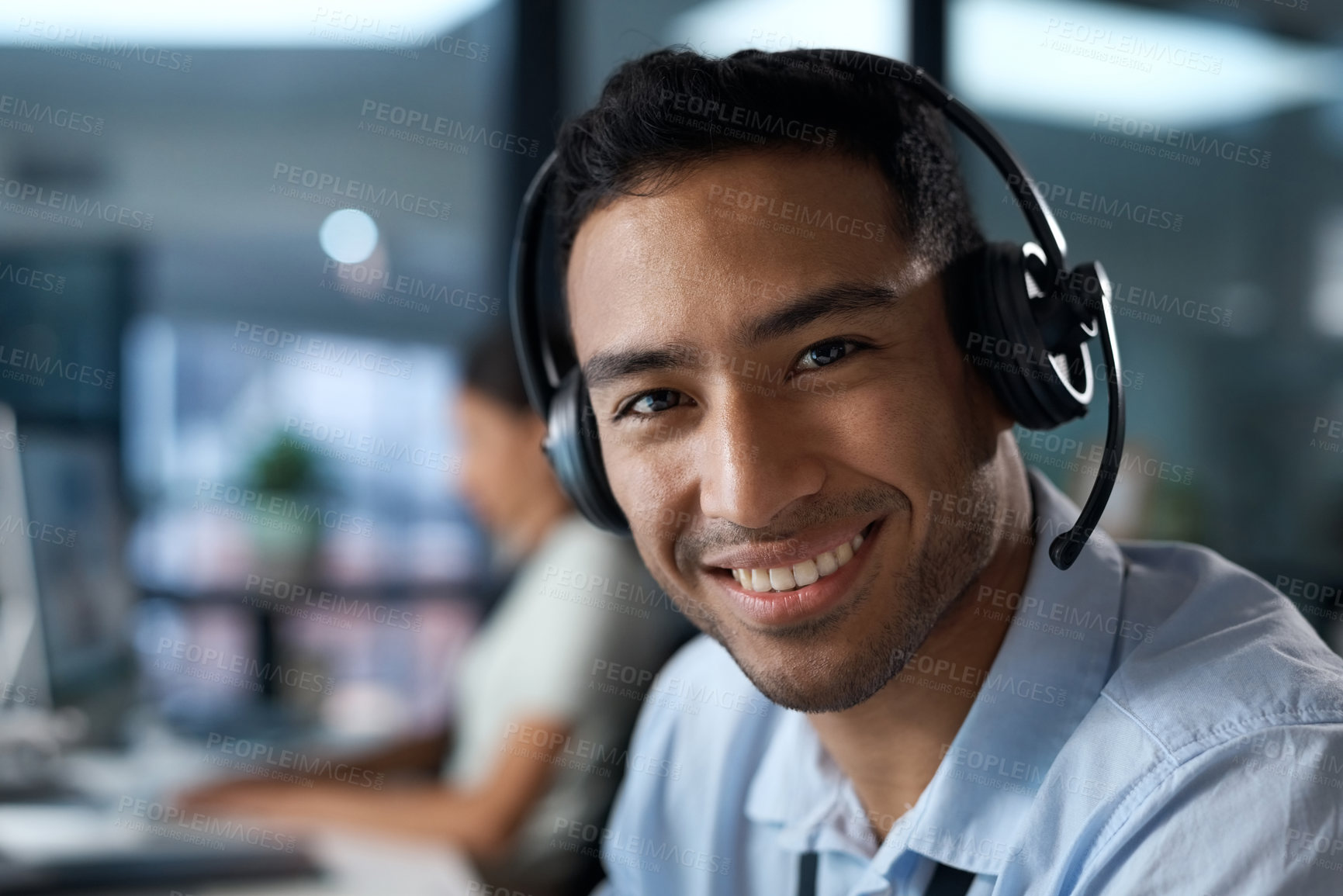 Buy stock photo Portrait of a young man using a headset in a modern office
