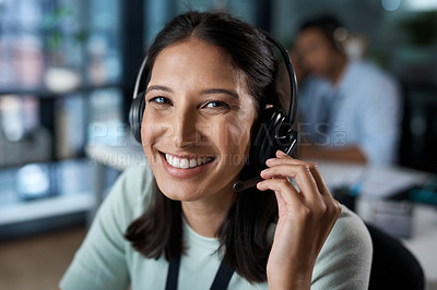 Buy stock photo Portrait of a young woman using a headset in a modern office