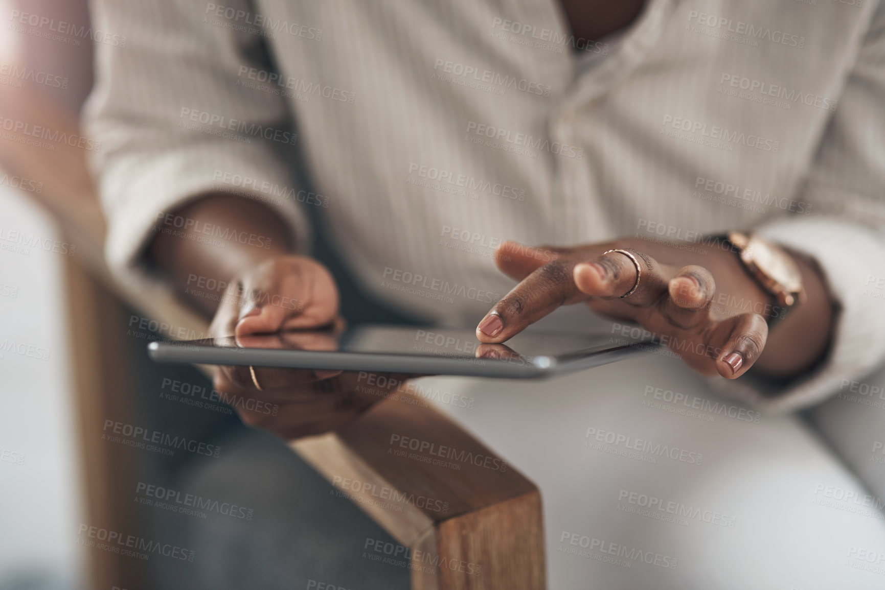 Buy stock photo Shot of a businesswoman using her digital tablet at work