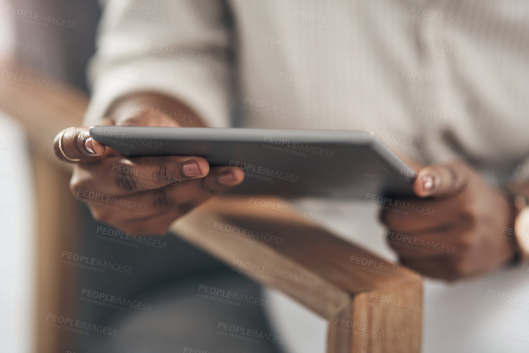 Buy stock photo Shot of a businesswoman using her digital tablet at work