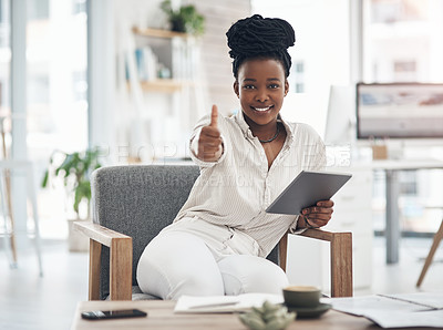 Buy stock photo Shot of a businesswoman using her digital tablet at work