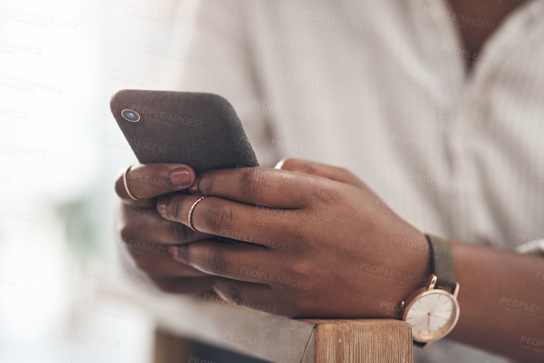 Buy stock photo Shot of a businesswoman using her smartphone to send text messages