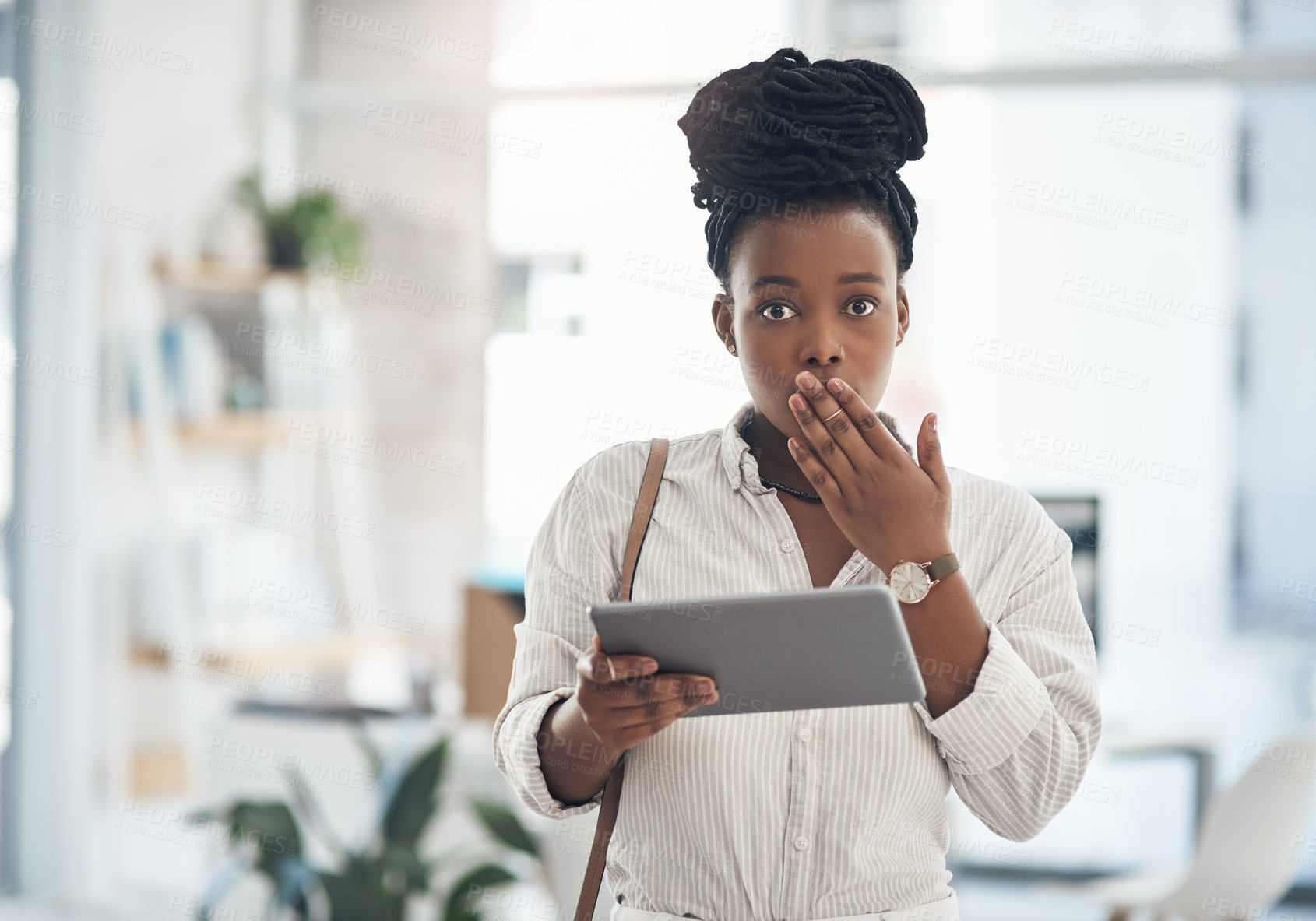 Buy stock photo Shot of a businesswoman using her digital tablet at work