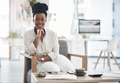 Buy stock photo Shot of a young businesswoman relaxing in her office