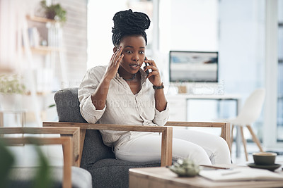 Buy stock photo Shot of a young businesswoman using her smartphone to make phone calls at the office