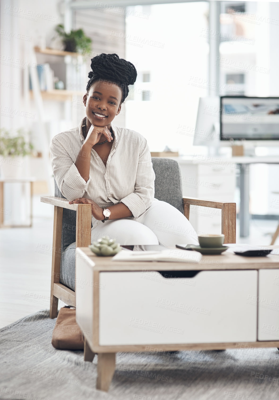 Buy stock photo Shot of a young businesswoman relaxing in her office