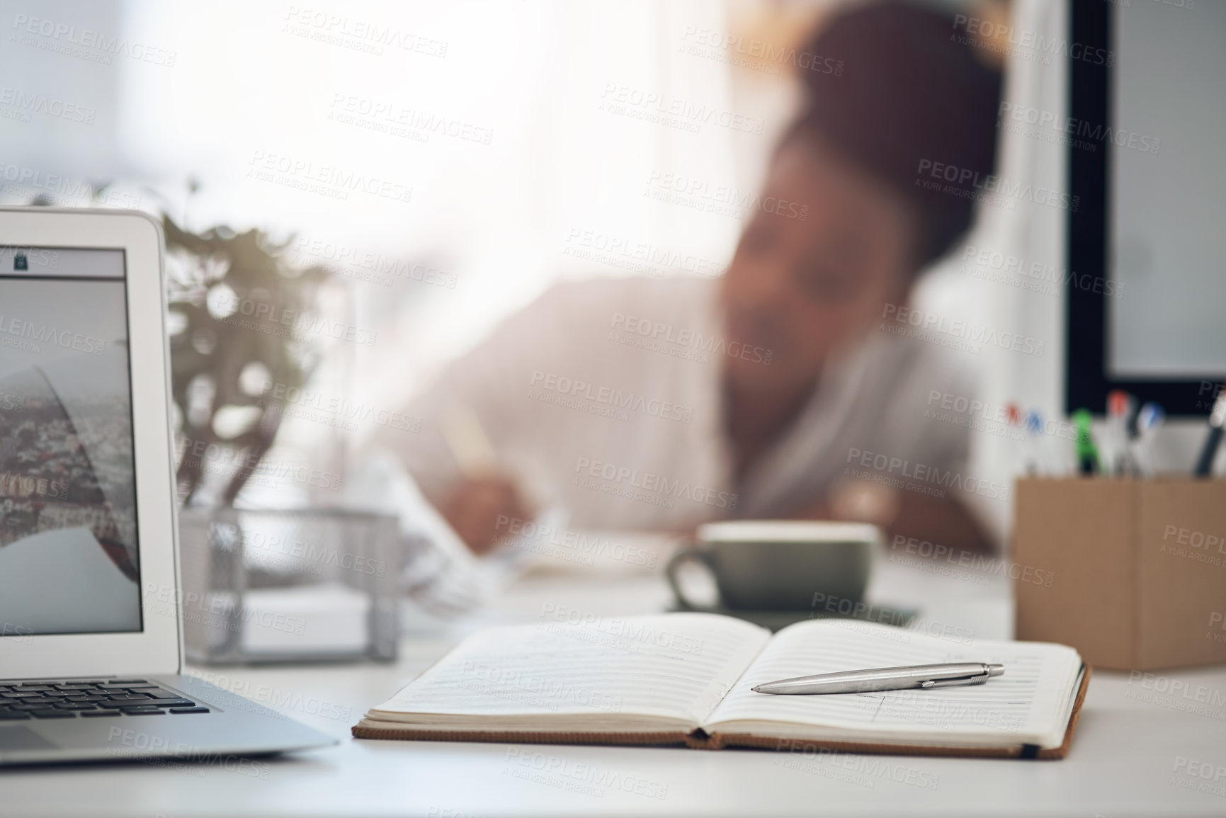 Buy stock photo Shot of a young businesswoman working at her desk