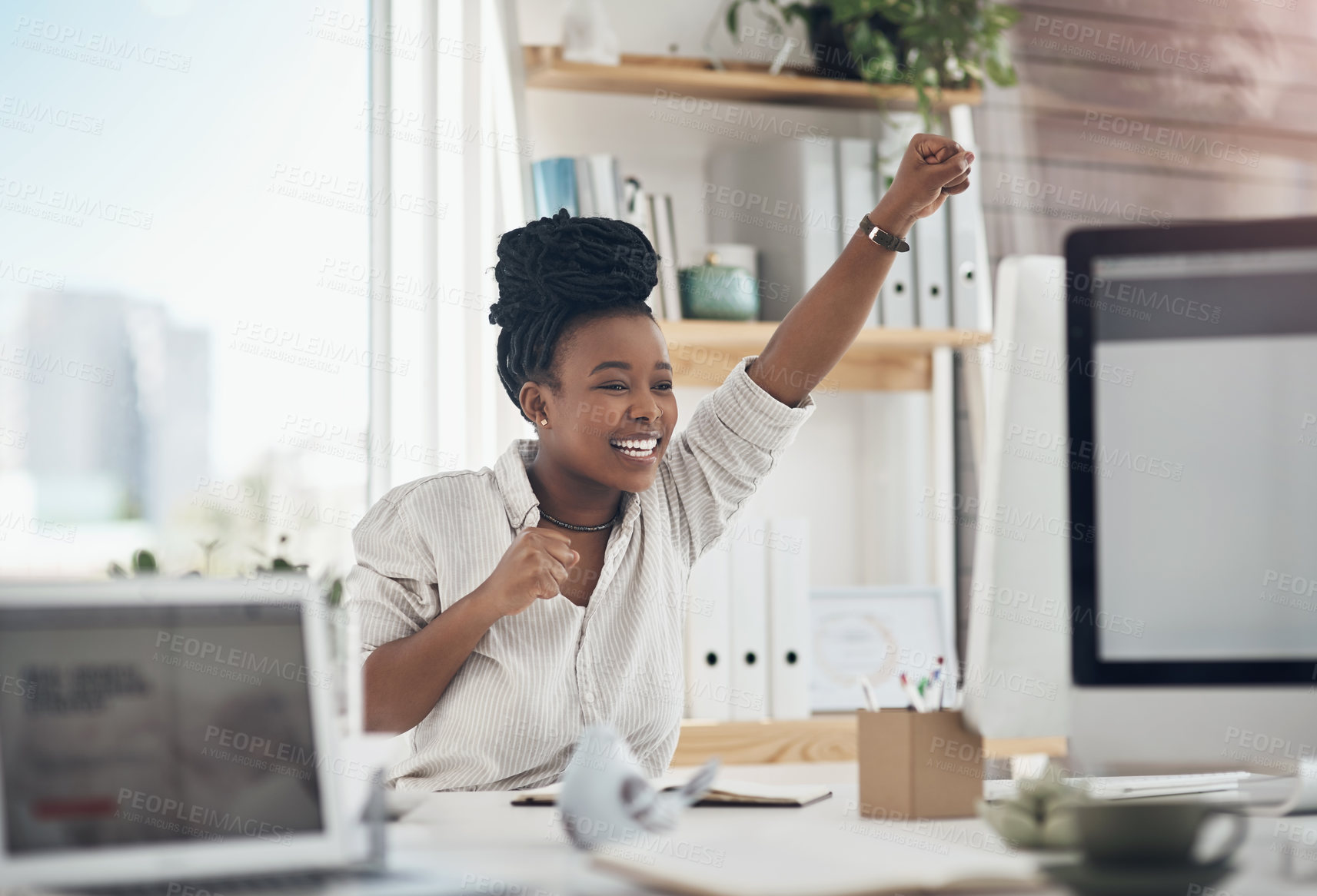 Buy stock photo Shot of a young business celebrating by cheering in her office