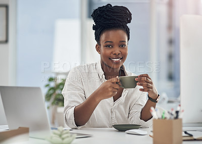 Buy stock photo Shot of a businesswoman enjoying a cup of coffee at work