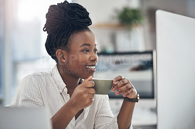 Buy stock photo Shot of a businesswoman enjoying a cup of coffee at work