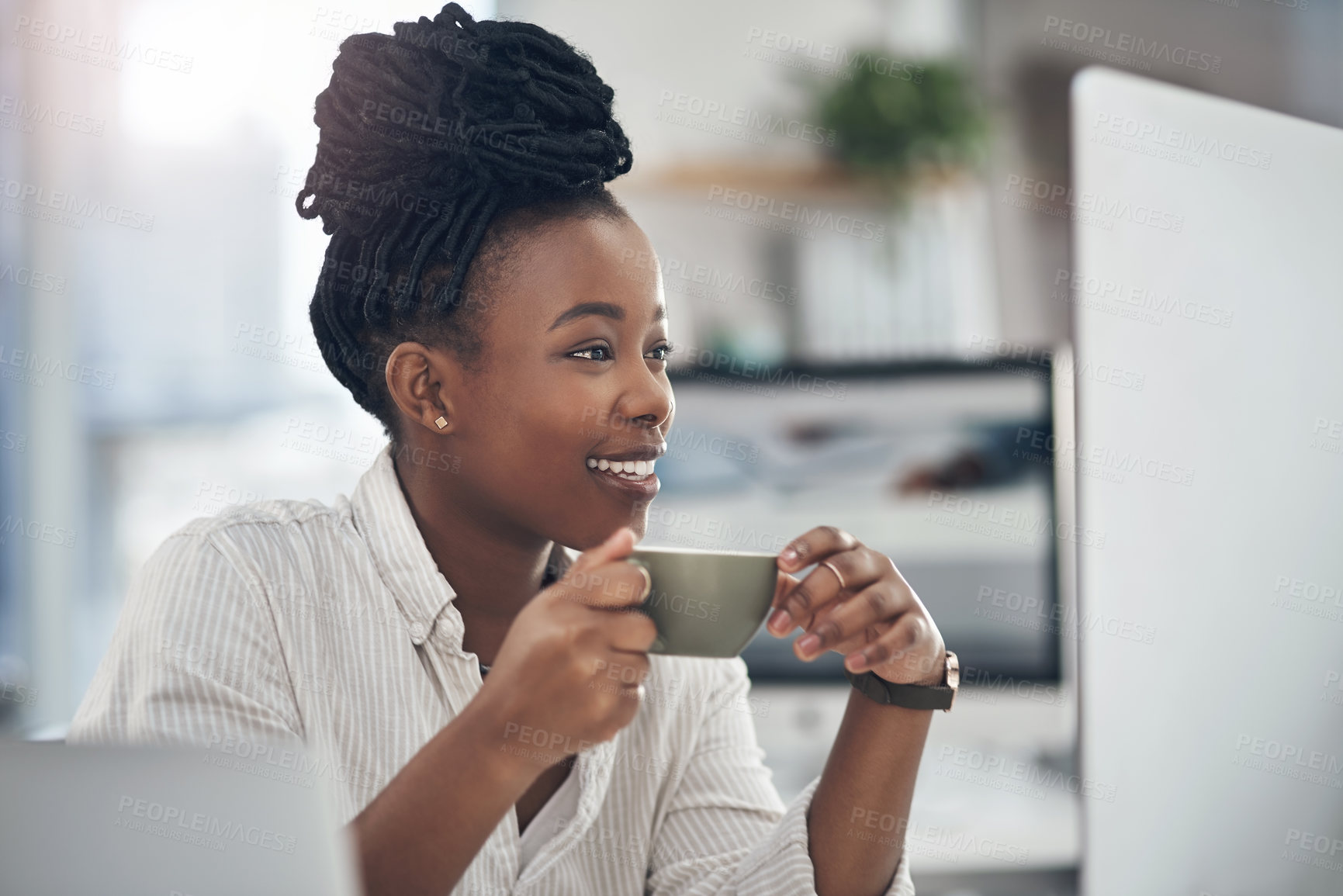 Buy stock photo Shot of a businesswoman enjoying a cup of coffee at work