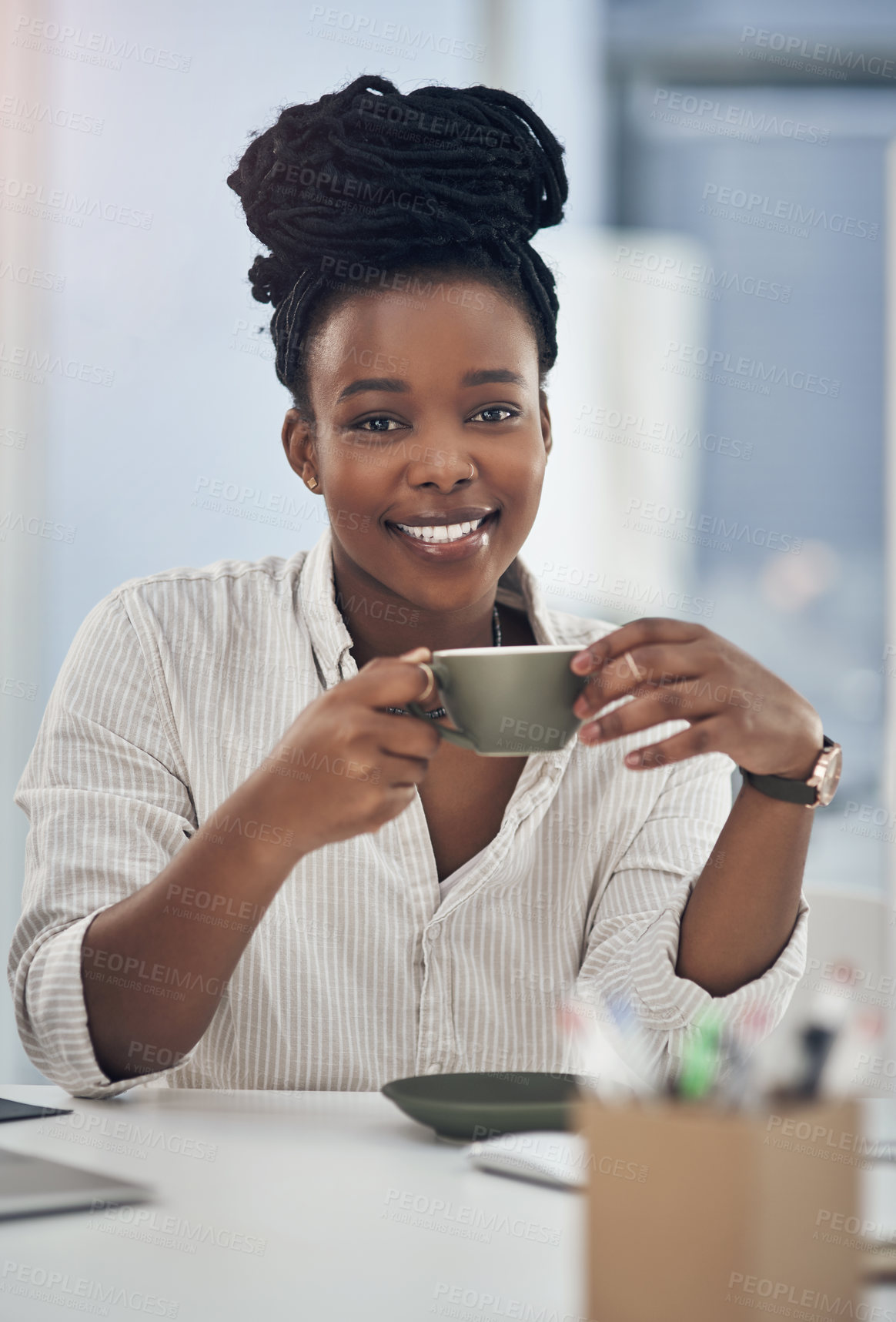 Buy stock photo Shot of a businesswoman enjoying a cup of coffee at work