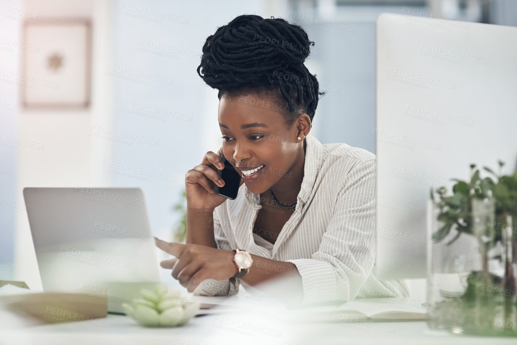 Buy stock photo Shot of a young businesswoman using her smartphone to make phone calls at the office